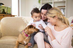 Smiling moms, baby, and dog, LGBTQ friendly birth doulas in Towson, Baltimore, Owings Mills