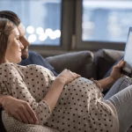 expectant couple ipad learning about latent labor