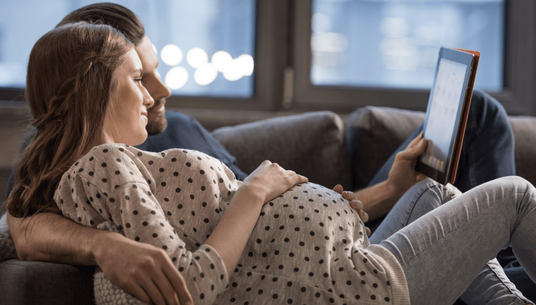 expectant couple ipad learning about latent labor