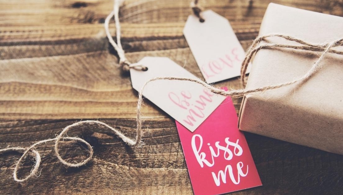 valentines package on wood table tips for sex & romance after baby