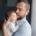 A father tries to soothe his baby as they cry in his arms.