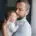 A father tries to soothe his baby as they cry in his arms.