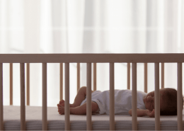 Baby sleeping safely on back in crib