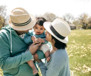 Happy family with baby smiles