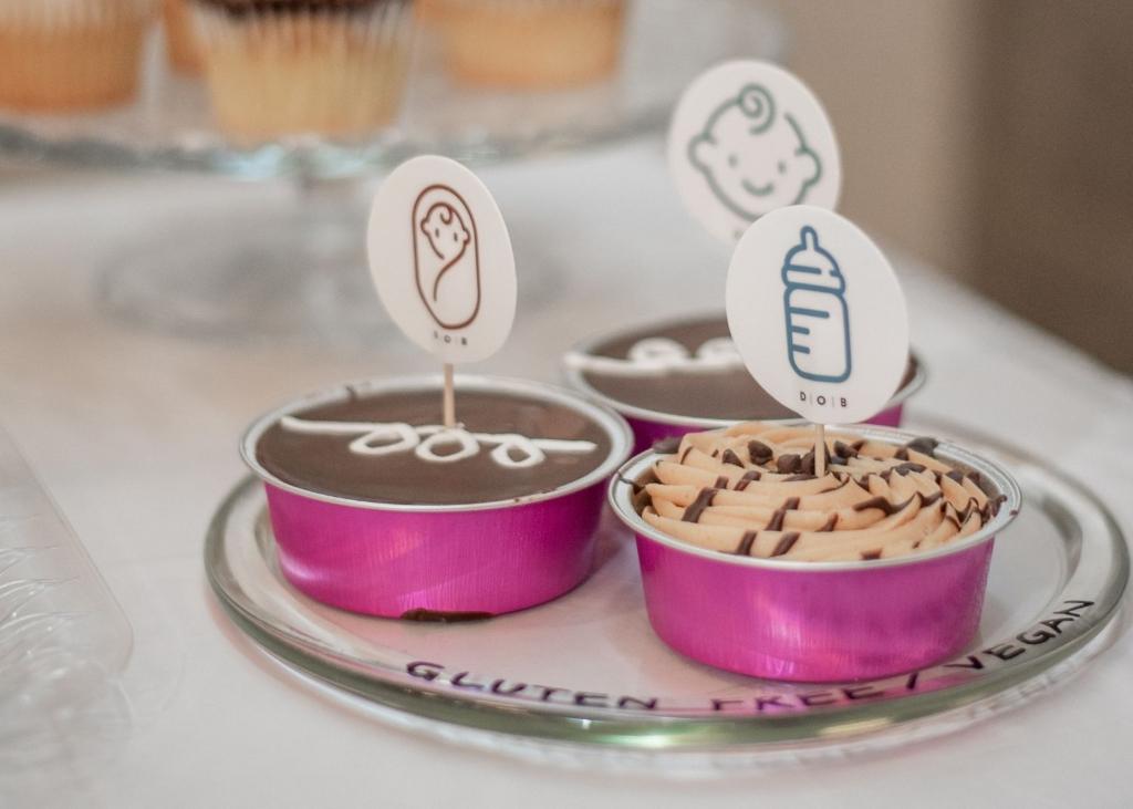 Gluten-free treats featuring babies and bottles adorn the tables at the tenth birthday party for Doulas of Baltimore.