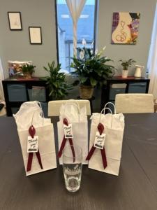 A custom etched glass is featured alongside treat bags for the 10th birthday party of Doulas of Baltimore.