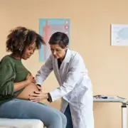 A pregnant individual consults with their doctor in Baltimore, Maryland.