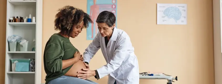 A pregnant individual consults with their doctor in Baltimore, Maryland.
