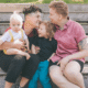 An LGBT family spends time together on the steps at a park in Baltimore, Maryland