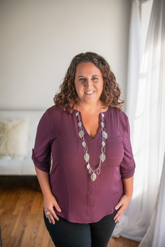 Deborah Bailey, co-owner of Doulas of Baltimore, smiles in a well-lit room