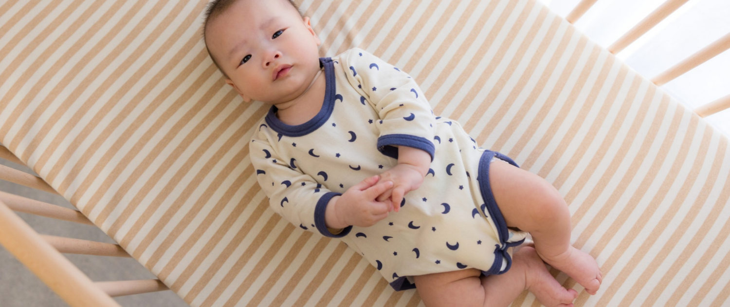 A baby is put to sleep safely using the ABC guidelines.