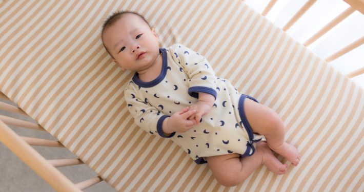 A baby is put to sleep safely using the ABC guidelines.
